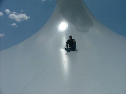 Ami Korren sitting on top of the roof of the Yamit 2000 enclosed pool